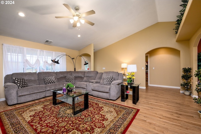 living room featuring wood-type flooring, ceiling fan, and lofted ceiling