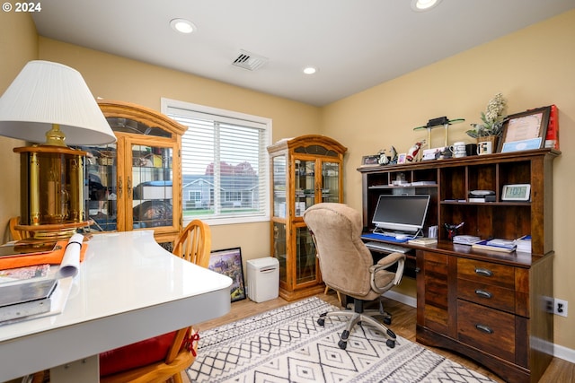 office with light hardwood / wood-style floors