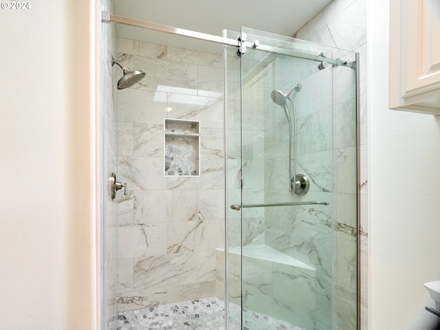 bathroom with an enclosed shower