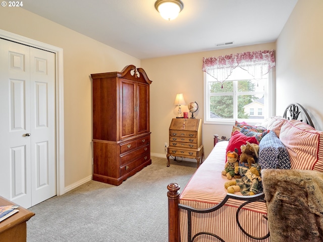 carpeted bedroom featuring a closet