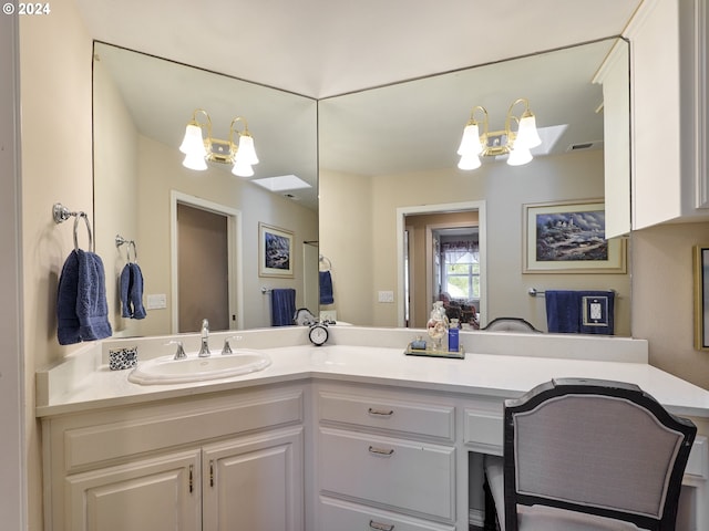 bathroom featuring vanity and an inviting chandelier