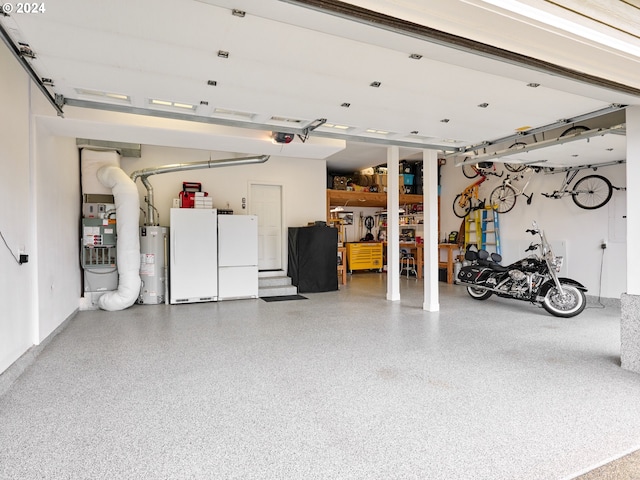 garage with white refrigerator and water heater