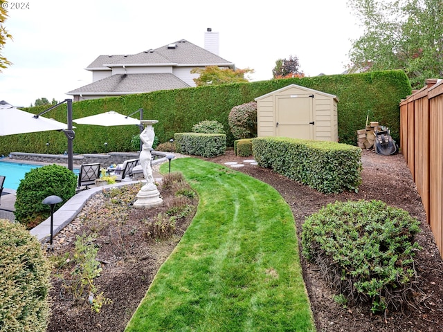 view of yard featuring a storage unit