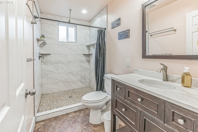 314 S Hazel St, Brookings, OR 97415 - full bathroom with toilet, vanity, and tiled shower