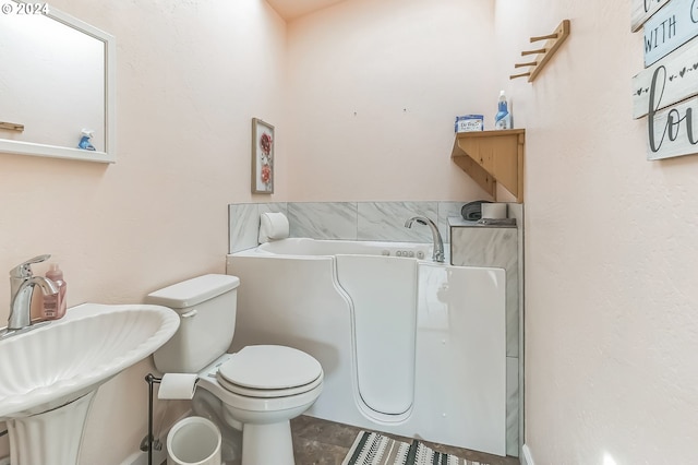 314 S Hazel St, Brookings, OR 97415 - bathroom with toilet, a sink, a bathtub, and tile patterned flooring