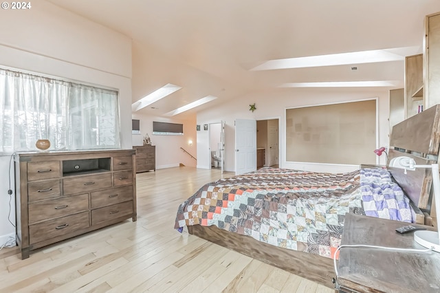 314 S Hazel St, Brookings, OR 97415 - bedroom with vaulted ceiling, light wood-style flooring, and a skylight