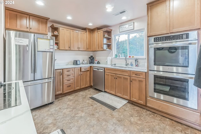 314 S Hazel St, Brookings, OR 97415 - kitchen featuring open shelves, appliances with stainless steel finishes, a sink, recessed lighting, and light stone counters