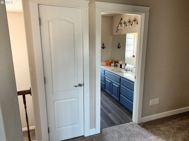 bathroom with vanity and hardwood / wood-style floors