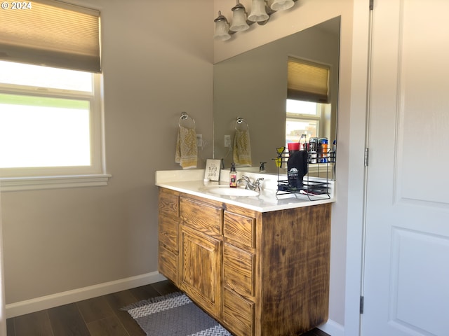 bathroom featuring hardwood / wood-style flooring and vanity