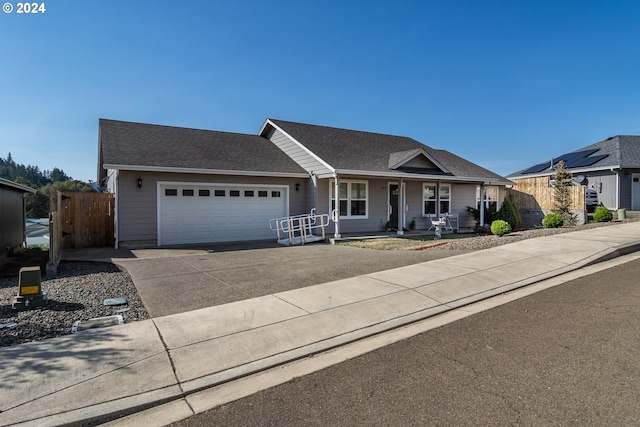 ranch-style house featuring a garage