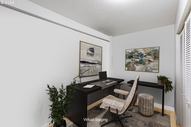 office featuring a textured ceiling and hardwood / wood-style flooring