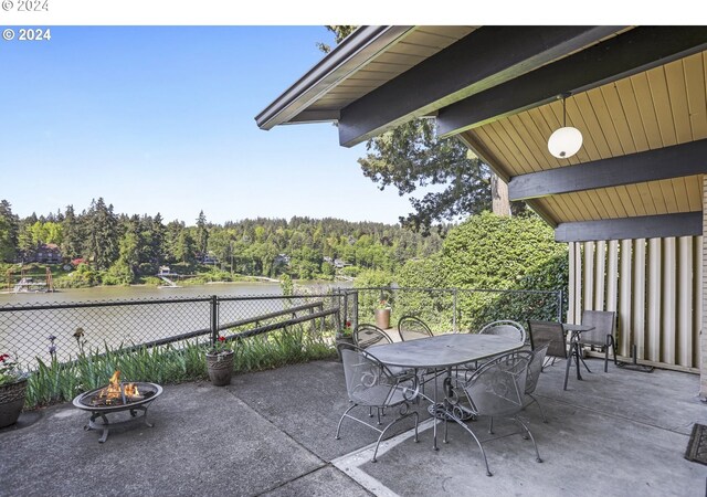 view of patio / terrace featuring an outdoor fire pit