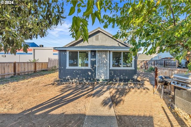 bungalow featuring an outbuilding