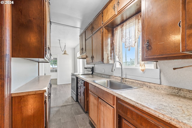 kitchen featuring stainless steel electric range oven and sink