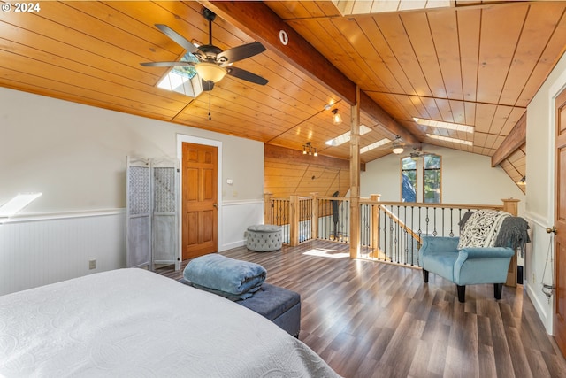 bedroom featuring vaulted ceiling with skylight, dark wood-type flooring, wainscoting, and wood ceiling