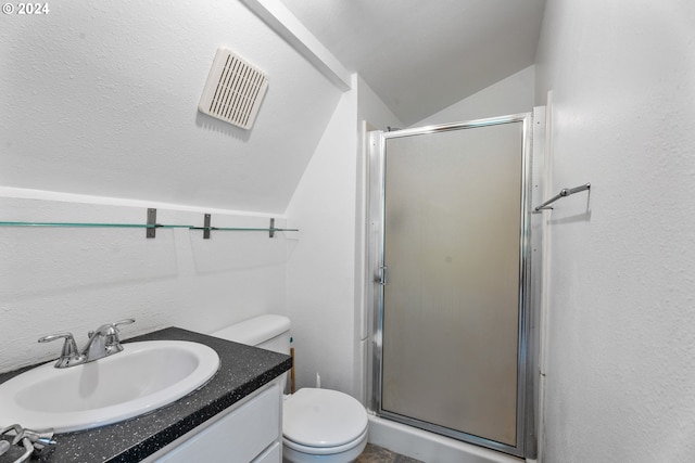 full bathroom featuring toilet, vanity, visible vents, vaulted ceiling, and a shower stall