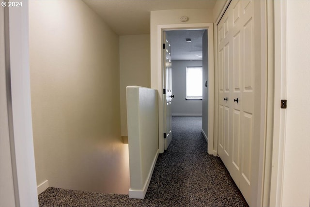 corridor with dark carpet