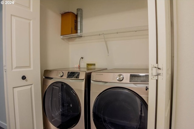 laundry room featuring washing machine and dryer