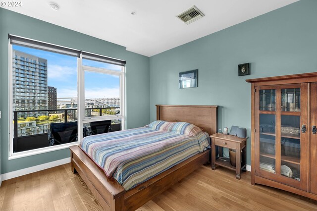 bedroom with light hardwood / wood-style flooring