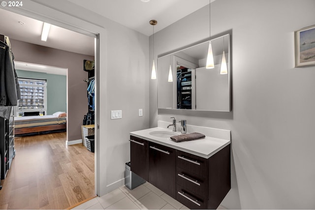 bathroom with vanity and hardwood / wood-style floors