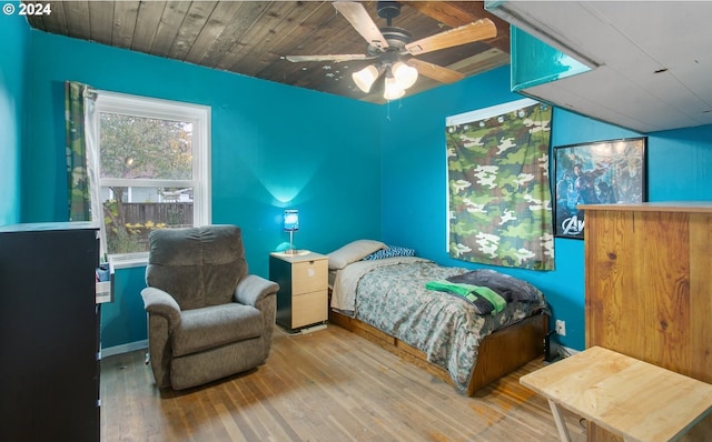 bedroom featuring wood-type flooring and ceiling fan