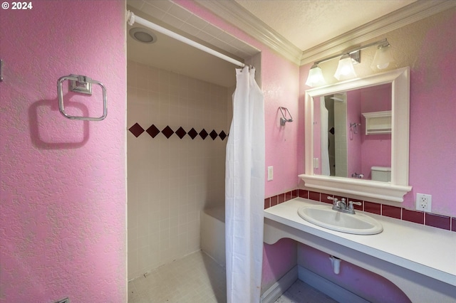 94213 Kerber Dr, Langlois, OR 97450 - bathroom featuring a sink, a textured wall, ornamental molding, and curtained shower