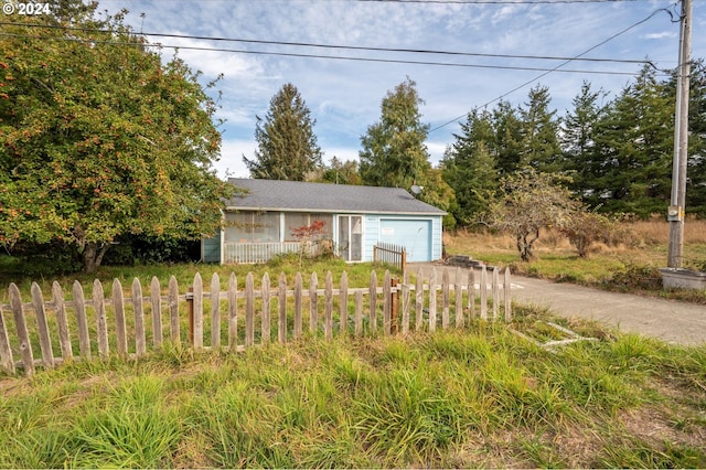 94213 Kerber Dr, Langlois, OR 97450 - view of front facade with an attached garage, driveway, and fence