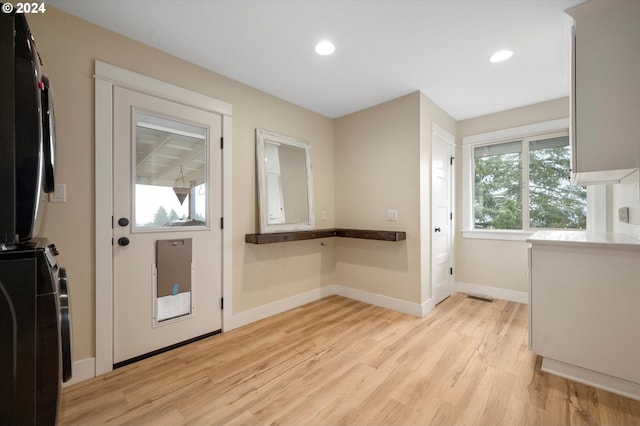 interior space with light hardwood / wood-style flooring