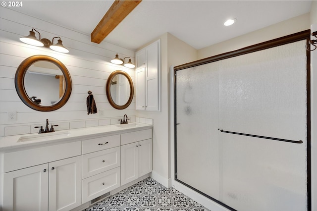 bathroom with vanity, beam ceiling, and an enclosed shower