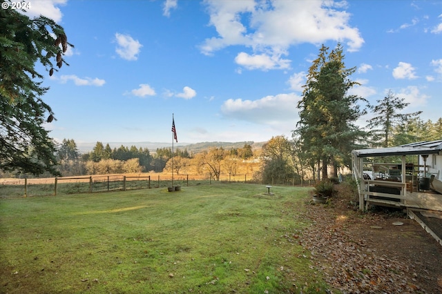 view of yard with a rural view