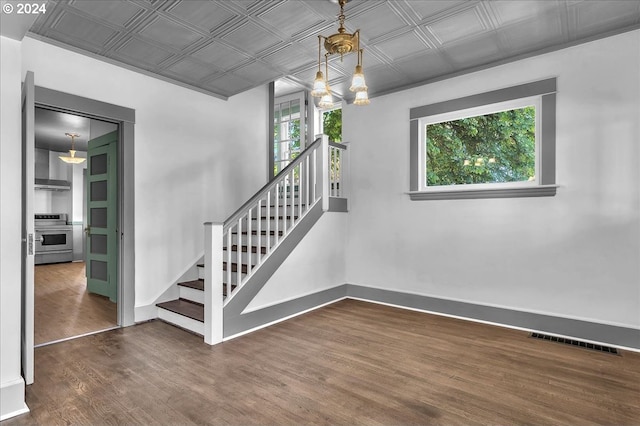 staircase with hardwood / wood-style flooring