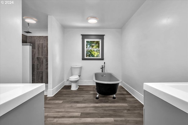 full bathroom with separate shower and tub, hardwood / wood-style flooring, vanity, and toilet