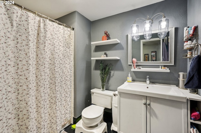 bathroom featuring a shower with curtain, vanity, and toilet