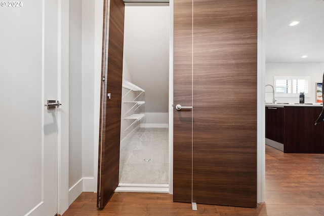 bathroom with vanity and hardwood / wood-style floors