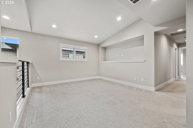 basement featuring light colored carpet