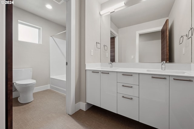 full bathroom featuring tub / shower combination, vanity, and toilet