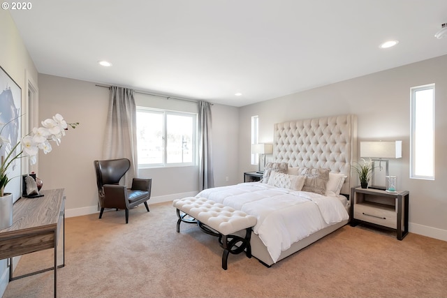 bedroom with light colored carpet