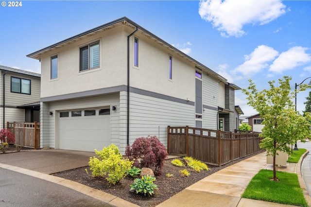 view of side of property with a garage