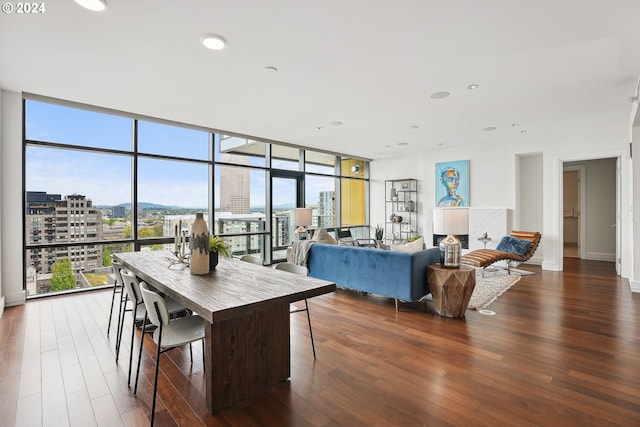 dining room with dark wood-type flooring and floor to ceiling windows