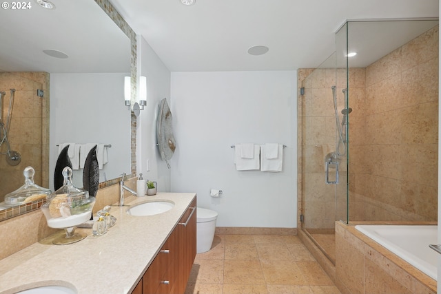 full bathroom featuring tile patterned flooring, plus walk in shower, vanity, and toilet