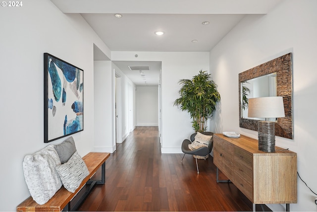 hall with dark hardwood / wood-style flooring