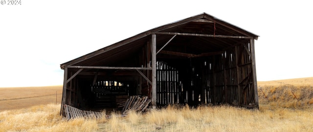 view of outbuilding featuring a rural view