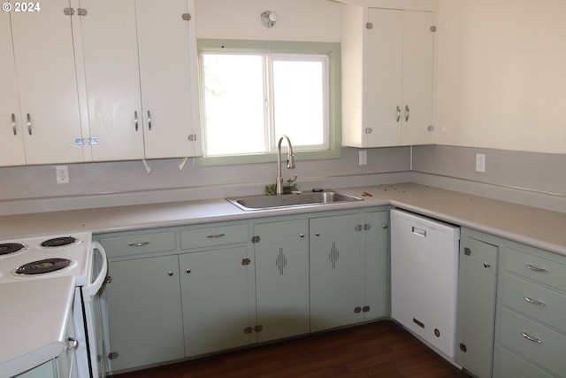 kitchen with white appliances, dark hardwood / wood-style floors, white cabinetry, and sink