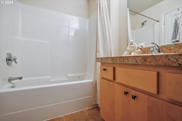 bathroom featuring vanity, shower / bathtub combination with curtain, and tile patterned flooring