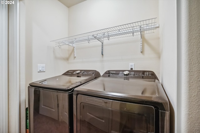 washroom featuring washer and dryer