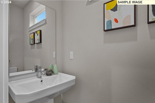 bathroom with sink and toilet