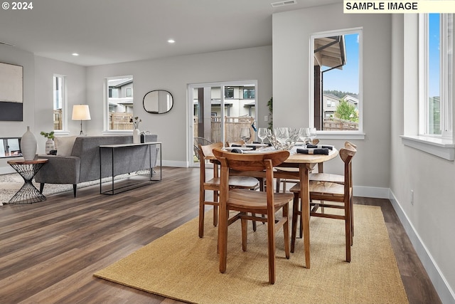 dining room with dark hardwood / wood-style floors