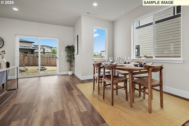 dining space featuring wood-type flooring