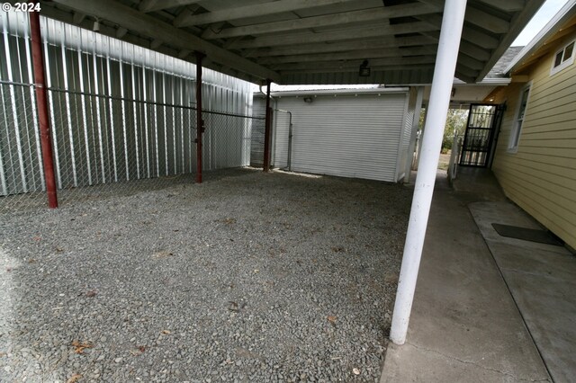 garage featuring a carport