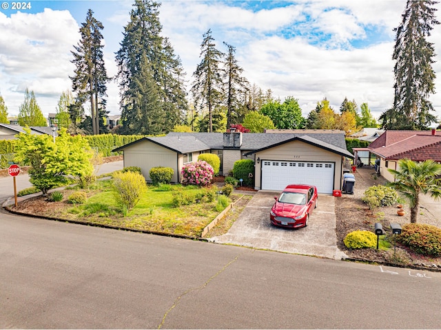 single story home featuring a garage